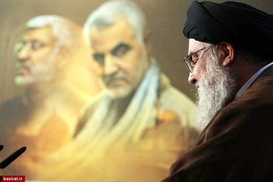 تصویری زیبا از نگاه سردار سلیمانی هنگام سخنرانی سید حسن نصرالله